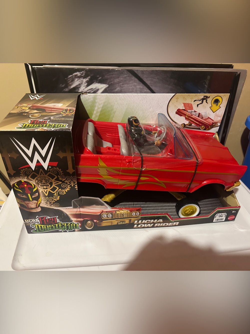 WWE Red Lowrider Toy Car with Gold Flame Graphics and Figure